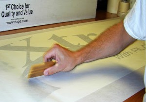 Avoid trapping air bubbles between the vinyl graphics and the application tape.    