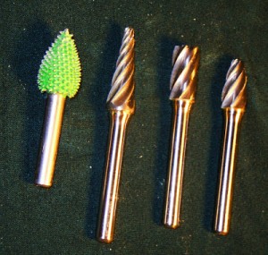 When roughing out a carving a coarse carbide burr will chew through wood in no time. 
