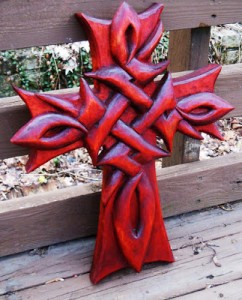My crucifix carving was dyed with an alcohol-based analine dye.  After the dye had thoroughly dried, the carving was treated with several coats of tung oil. Read more about drying oils at Finishing with Tung Oil.
